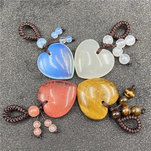 Set of four heart-shaped agate crystal pendants with woven ropes in multiple colors