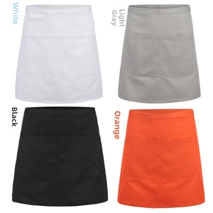 Detail view of four half-aprons with double pockets in white, grey, black and orange