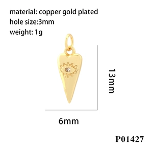 Macro detail of gold plated copper eye charm with micro-paved zircon and dimensions