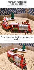 Detail of four-piece vintage Christmas train set with Santa and tree on festive tracks