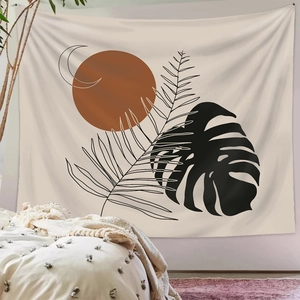 Bohemian tapestry featuring sun and monstera leaves hanging above a bedroom headboard