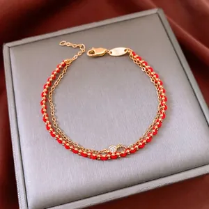 Double-layer 18k gold plated bracelet with red silk rope and sparkling zircon stone