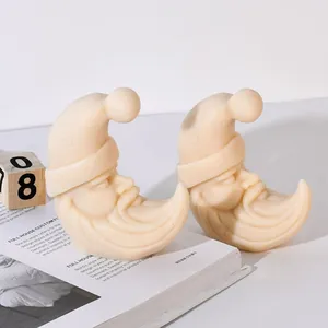 Detail of Christmas moon Santa silicone candle mold with moon and star hat design