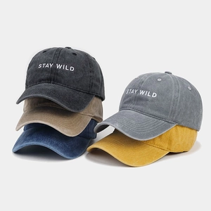 Collection of washed cotton baseball caps with Stay Wild embroidery in multiple colors