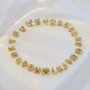 Golden brass 3D bubble letter alphabet set A-Z for DIY necklaces on white silk