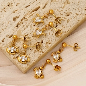 Golden titanium steel crab and turtle stud earrings set with oval zircon accents