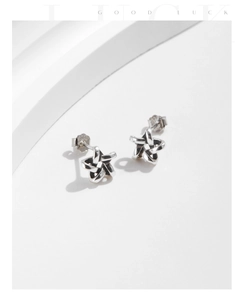 Detailed view of hollow pentagram S925 sterling silver studs with vintage finish