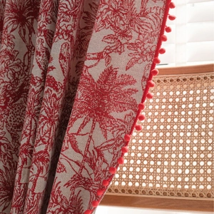 Red and white vintage floral curtains with cotton-linen texture and red pompom trim details