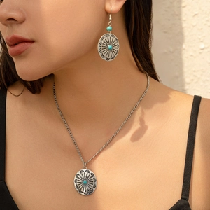 Vintage boho necklace and earrings set with turquoise beads and sunburst design on model