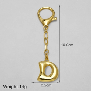Detail view of 18k gold plated letter D keychain pendant with dimensions and weight