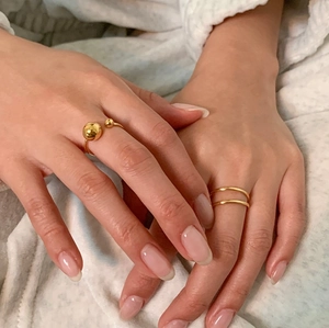Close-up of gold geometric bead open ring and double layer minimalist band for women