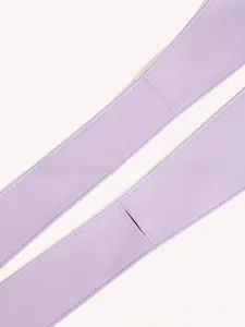 Detailed macro shot of light purple faux leather waist belt showing lychee grain texture