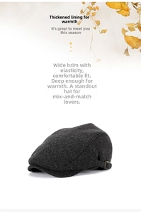 Detail of dark grey newsboy cap with thick warm lining and curved wide brim design