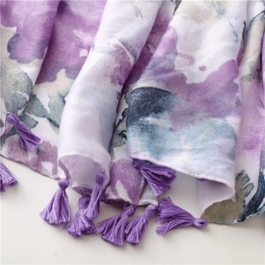 Detailed view of the purple tassels and watercolor ink painting print on soft scarf
