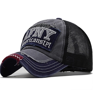 Detailed embroidery on vintage washed cotton baseball cap with distressed brim and mesh back