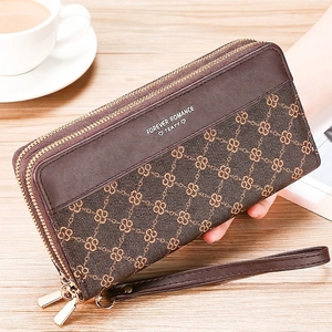 Close-up of women's vintage long wallet with double zipper and geometric print