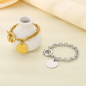 Polished 9mm OT toggle chain bracelet with round charm in gold and silver finish