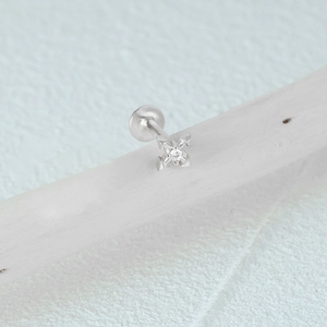 Detailed macro view of S925 silver star labret stud with a clear zircon stone