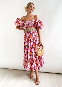 Close-up of the off-shoulder elastic bodice and multi-color abstract geometric print