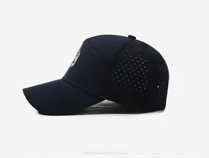 Detail view of navy baseball cap featuring laser-cut ventilation holes and side logo