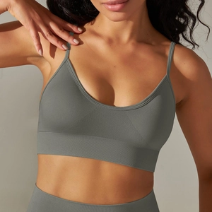 Close-up of olive green seamless knitted sports bra featuring ribbed texture and V-neck