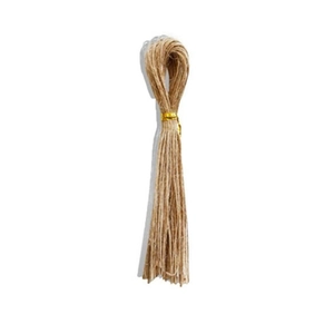 Close-up of natural fiber jute twine bundle tied with a gold band for gift wrapping