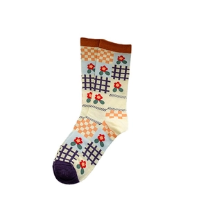 Mid-calf cotton socks featuring colorful patchwork with orange checkers and floral patterns