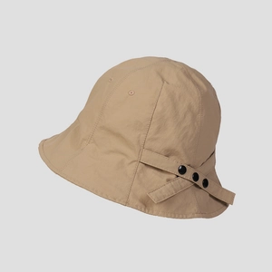 Detail showing khaki bucket hat's breathable vents and decorative black buckles