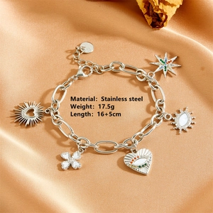 Detailed view of evil eye charms on stainless steel link bracelet with 16+5cm length spec
