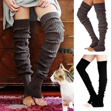 Detailed knit texture of Halloween pumpkin themed crew socks in dark brown and black