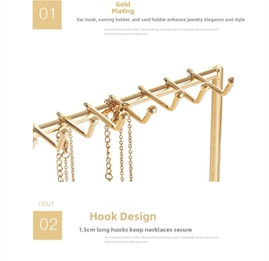 Close-up of 1.5cm golden electroplated metal hooks for jewelry card and necklace display