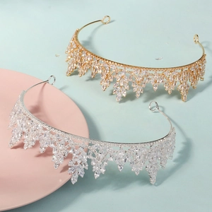 Detail of luxury bridal crowns in gold and silver finish with sparkling zircon stones