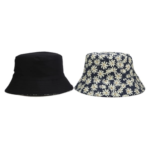 Reversible floral bucket hat with daisy print and plain black cotton canvas design