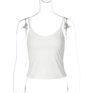 Detail of delicate lace trim on the V-neck of a white slim fit camisole top