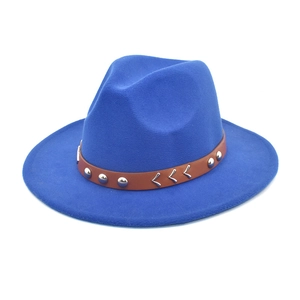 Detailed view of blue wool fedora hat with brown leather band and silver metal rivets