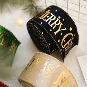 Christmas ribbons with gold stars and Merry Christmas print in green and beige