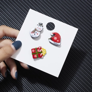 Three-piece Christmas brooch set featuring snowman, hat, and gift box on white card