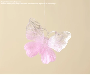 Detail of pink translucent acrylic butterfly ornament with glitter for Christmas tree