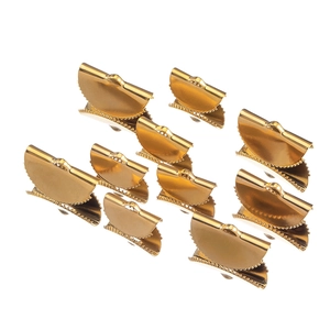 Detailed view of ten golden semicircular crimp ends for jewelry and ribbon finishing