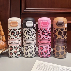 Leopard print stainless steel tumblers with pop-up lids and Glam Royal branding