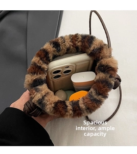 Internal view of leopard print plush bucket bag showing spacious storage for daily items