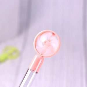 Detail of pink creative pencil with functional mini fan blade on top for students