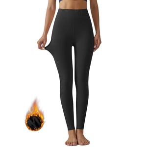 Detail of high-waist thermal leggings showing superior elasticity and fleece lining