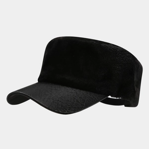 Detailed view of black plush textures and faux snake skin leather brim on military cap