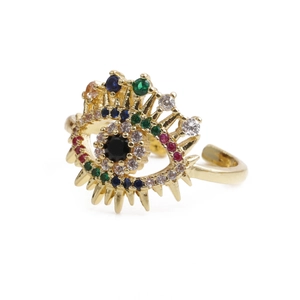 Macro shot of evil eye ring with colorful zircons and gold plated finish details