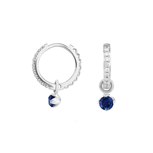 Detailed macro view of S925 silver hoop earrings with micro diamonds and blue gemstone