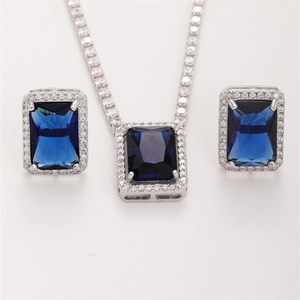 Elegant silver jewelry set with rectangle dark blue gemstones and white diamond accents