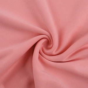 Detailed close-up of soft pink sweatshirt fabric texture with smooth drape and weave