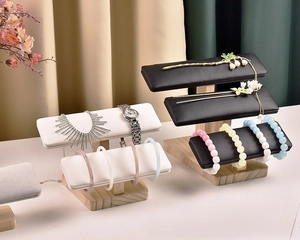 Macro detail of multi-layer solid wood jewelry display stands for watches and bracelets