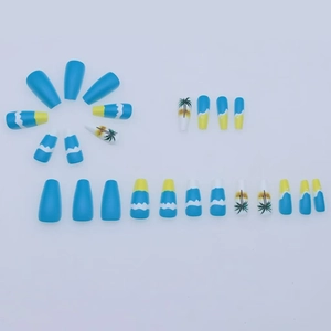 Blue and yellow coffin press-on nails with ocean waves and palm tree beach designs